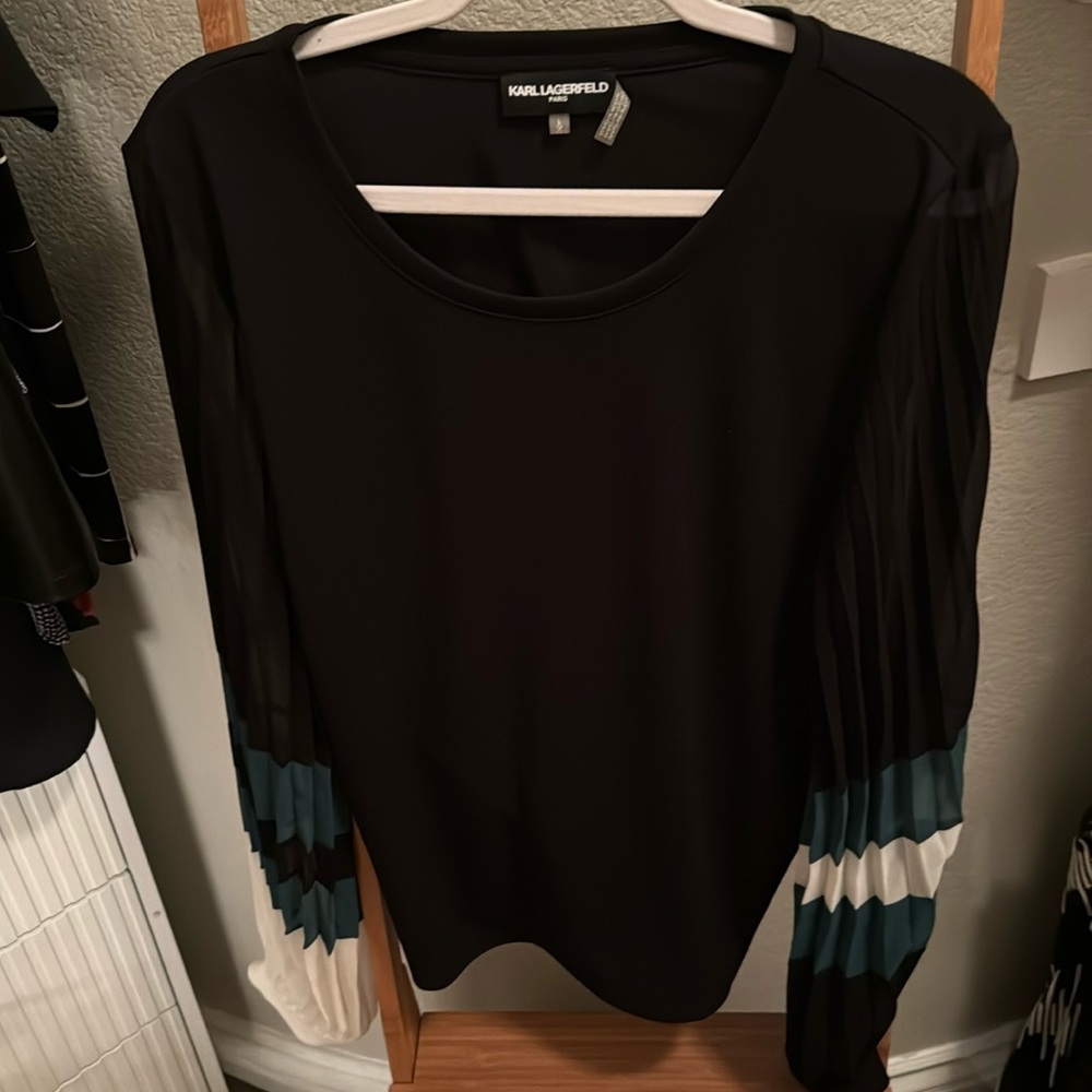 Black blouse with fun sleeves, new no tags.